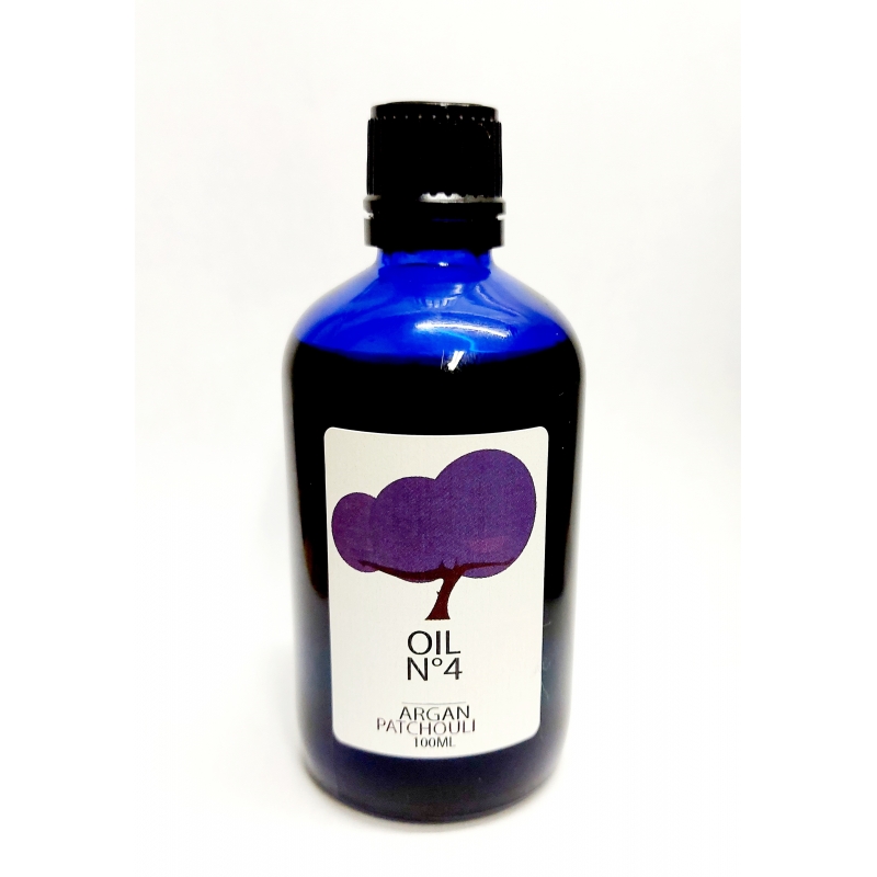 Huile d'argan bio premium infusion huiles essentielles de patchouli. 100% bio. bouteille en verre bleu foncé. 100ml